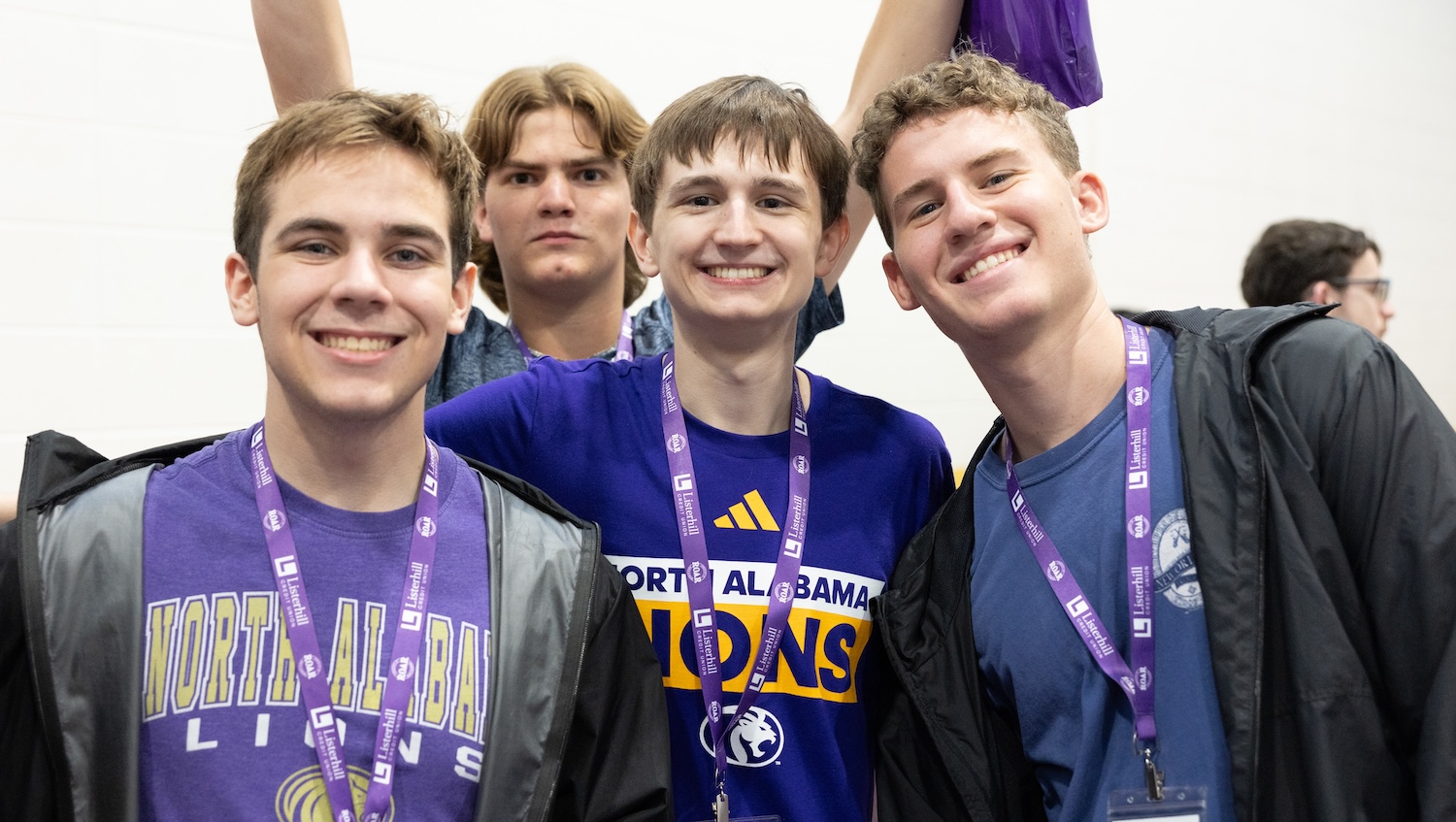 Camden Seal smiles in the middle of a group photo with three other incoming UNA students.
